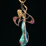 18K Dancer with multi colored sapphires and a natural abalone pearl dress