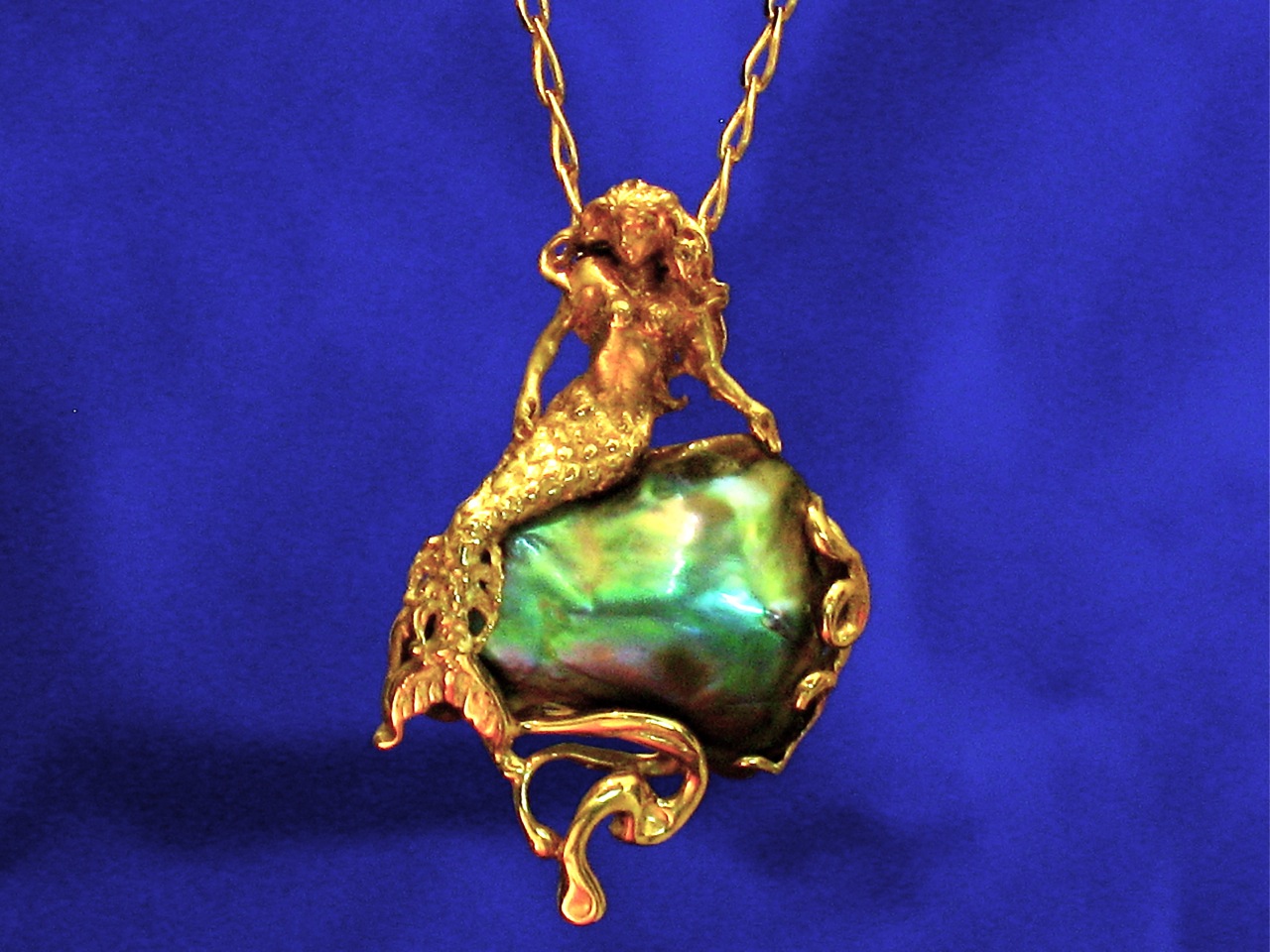 Natural Abalone Pearl Pendant with a 14K Mermaid resting on it